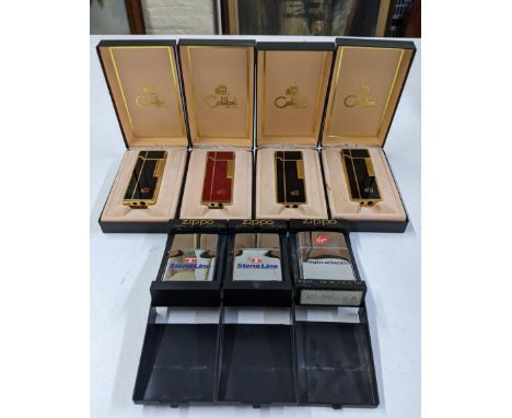 Four boxed Colibri lighters, three in black, one in red, and three boxed Zippo lighters with Virgin Atlantic livery, two with