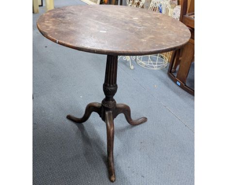 A Georgian oak carved tilt top table having a reeded column and on a tripod base, 71cm h x 65cm wLocation:If there is no cond