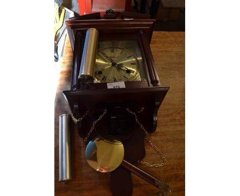Modern wooden wall clock with brass effect and dial