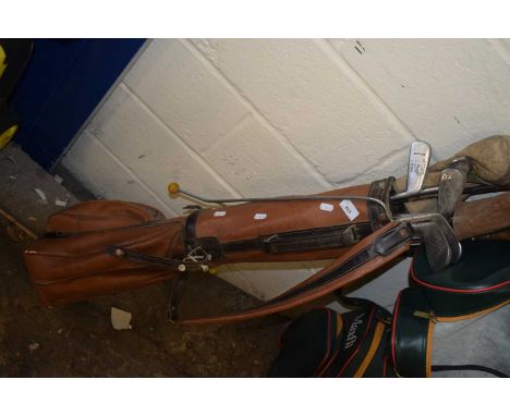 Case of vintage golf clubs