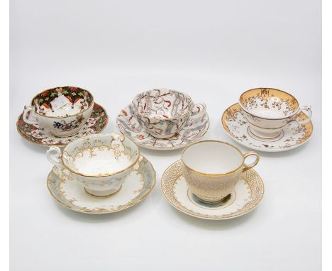 A collection of early to mid 19th Century tea cups and saucers, all different patterns