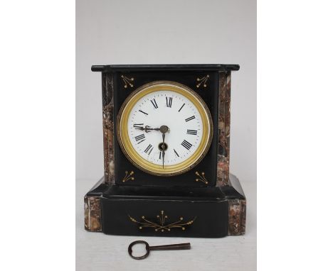 A late 19th Century French black slate mantle clock, AF, with key