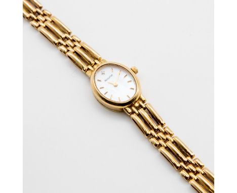 A ladies 9ct gold Accurist wristwatch, oval mother of pearl dial, applied gold tone batons, to a 9ct gold bracelet gate link 
