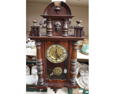 A late 19th Century walnut veneered Vienna wall clock, spring driven movement, chapter ring, 75cm high approx