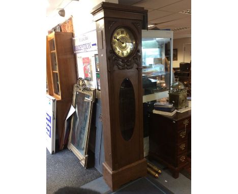 An Art Nouveau oak longcase clock, possibly French, brass dial and Arabic numerals, carved decoration, complete with two weig