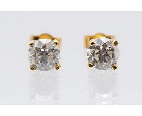 A pair of diamond and 9ct gold stud earrings, comprising claw set brilliant cut diamonds with a total weight approx. 1.23 car