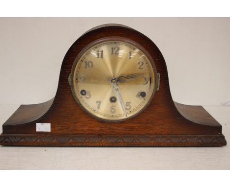 An 1940s oak cased mantle clock