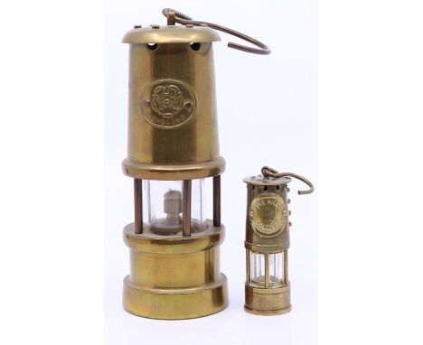 A small brass miners lamp, having a badge inscribed 'England' with a Tudor Rose, height approx. 24cm (including hook); togeth
