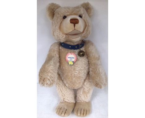 Steiff: A Steiff Teddy Baby 1949 Replica Bear, with blue collar, black bell and Limited Edition white tag and button in ear, 