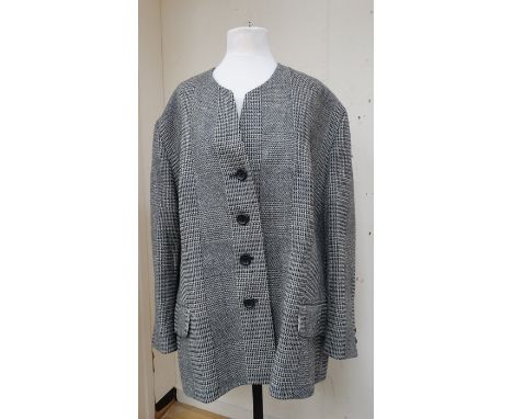A Prince of Wales check wool Givenchy jacket, fully lined, size 22 with a chain fastening for hanging up.&nbsp;