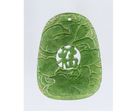 A carved jade pendant featuring carved koi carp and foliage, size approx 45 x 30mm, total gross weight approx 8.9gms Conditio
