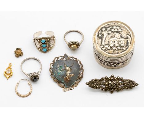 A collection of silver and white metal items to include a Siamese silver brooch, marcasite and silver brooch, two paste set r