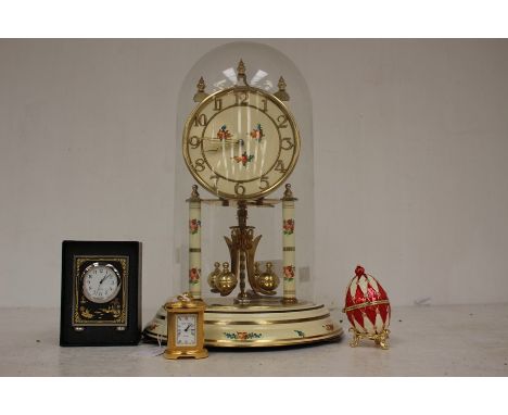 A late 20th Century anniversary clock with glass dome, key, a Roger Lascelles miniature time piece, a further clock and ename