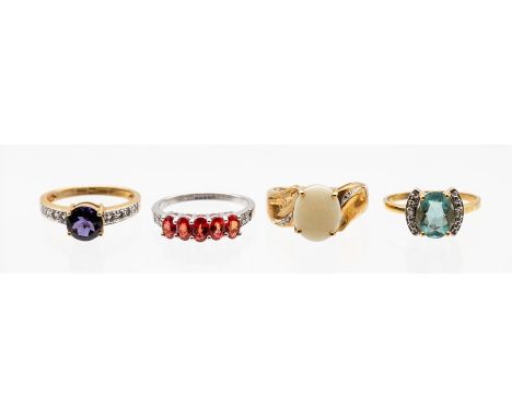 A collection of 9ct gold dress rings to include a semi black opal and diamond set ring, size O, a  Tanzanian ruby five stone 