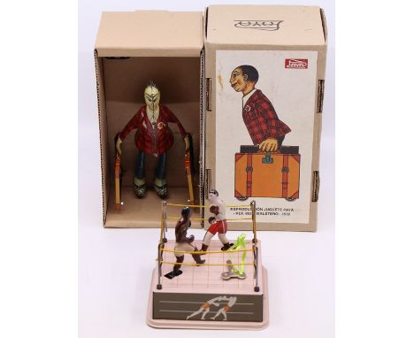A boxed Paya, tinplate, Traveller figure, a copy of an earlier version, tested, appears in working order, with key; together 