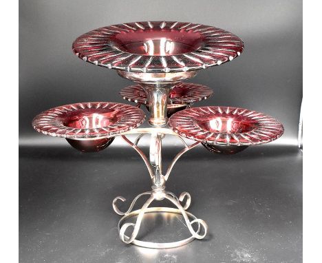 Early 20th Century silver plated table stand with ruby glass inserts, one large and three small examples