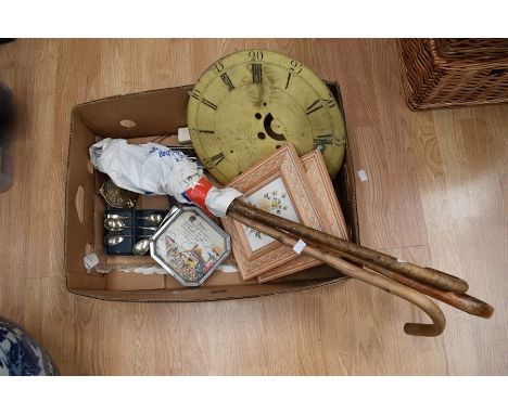 A collector's lot to include: an Andrew Holmes of Cheadle clock face; an assortment of EPNS spoons; two prints; three walking