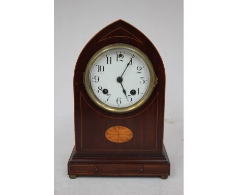 An Edwardian mahogany eight day mantel clock, circa 1905, having a white dial and two winder holes, parquetry inlay, with box