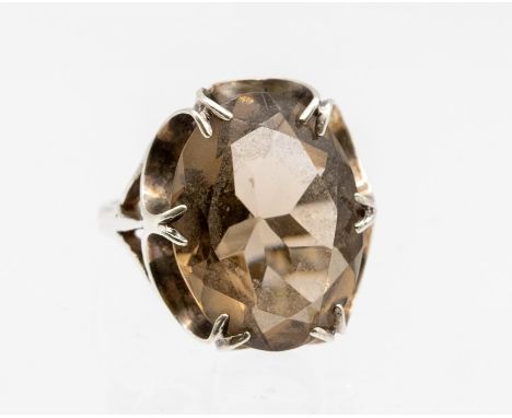 A smoky quartz oval dress ring, fancy claw set mount, setting approx 20 x 15mm, size N½, gross weight approx 2.3gms Condition