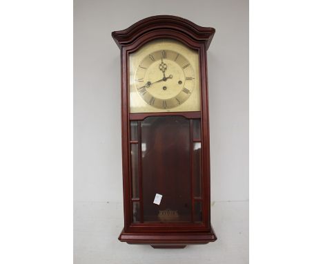 A 1970's wall clock with box