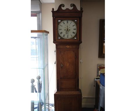 An early 19th Century oak and mahogany cross-banded eight day longcase clock, the dial inscribed ‘John Owen’, the hood with a