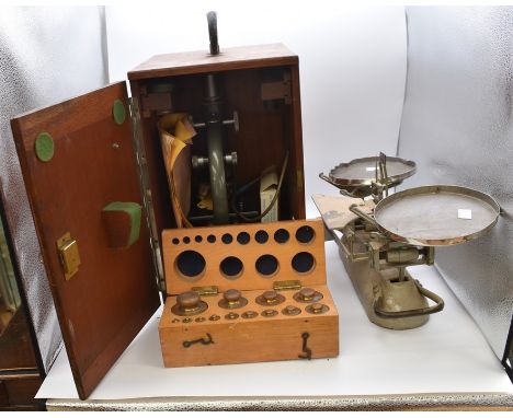 An A Baker 43843 London microscope (boxed) and a set of vintage scales with boxed weights (2)&nbsp;