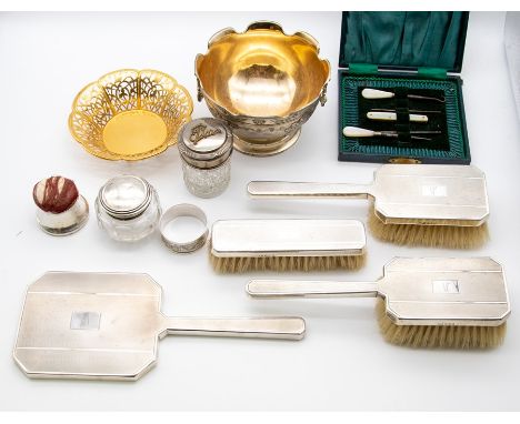 A Victorian silver mounted dressing table set to include mirror and three brushes, engine turned covers, hallmarked London, 1