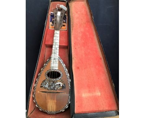 A late 19th Century Italian rosewood cased mandolin, spruce top front, ebony and mother of pearl banding, tortoiseshell panel