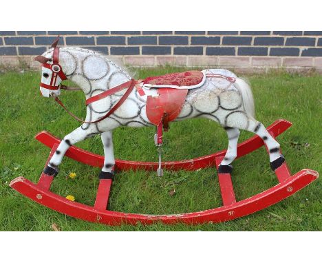 A vintage Stred rocking horse, circa mid 20th century, in need of attention, length approx. 104cm.