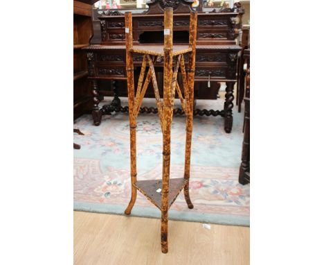 A late 19th Century Aesthetic bamboo jardiniere stand, raised on a tripod frame, 92cm high, 28cm wide