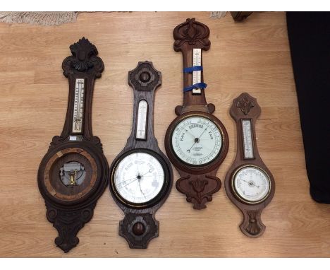 Four various barometers, each with an integrated thermometer, one with a missing barometer section, some AF (4)