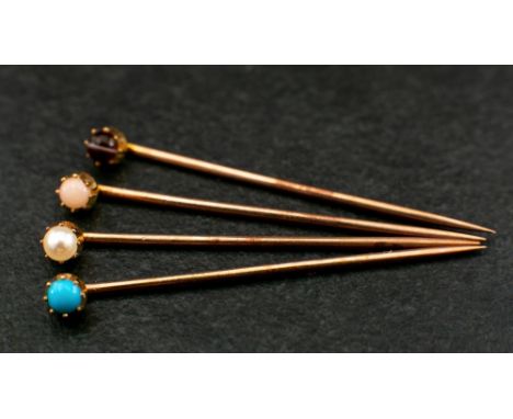 Four gemset stick pins,: respectively set with a cabochon-cut 'angel hair' coral, a seed pearl, a cabochon-cut turquoise and 