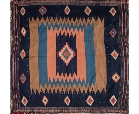An embroidered jidjim (Anatolian):, the serrated field in indigo, powder blue, brick red and camel colours, with a central st