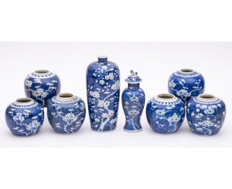 A group of Chinese porcelain blue and white jars and vases: all decorated in blue and white with prunus, comprising a vase of