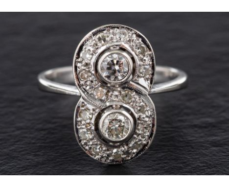 A round, brilliant and single-cut diamond ring in a figure of eight design,: estimated weight of principal diamonds ca. 0.25c