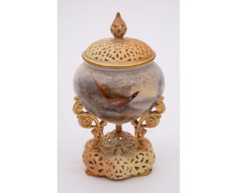 A Royal Worcester porcelain pot pourri jar and pierced cover: the jar supported on three scrolling legs on a pierced and lobe