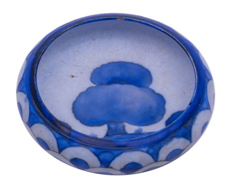 A small Moorcroft compressed circular bowl: decorated in the Dawn Landscape pattern, with fish scale exterior border, impress