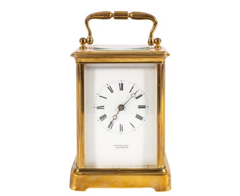 A Victorian French brass carriage clock: the eight-day duration movement having a platform cylinder escapement and stamped to