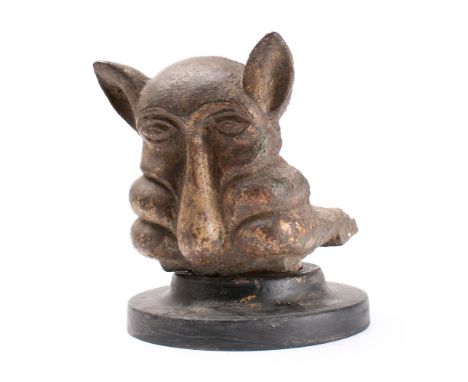A 19th Century cast iron gargoyle water hopper bracket: with grotesque face and pointed ears, 19cm high.