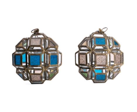 A pair of leaded glazed centre-light globe shades: inset with clear and coloured glass panels with suspension chains, 28cm hi