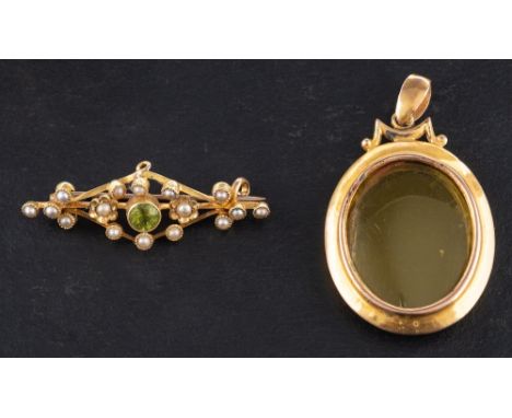 A 15ct gold locket together with a peridot and seed pearl brooch,: both the locket and the brooch stamped '15CT', length of b