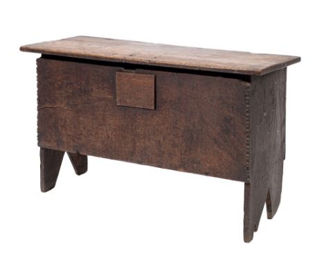 An oak 'six plank' coffer, first half 17th century,: with hinged rectangular cover, the front angles with simple notched carv