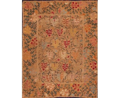 A Nain Suzani (Uzbekistan):, the light brown embroidered field with scrolling palmette and foliate designs, enclosed by a sim