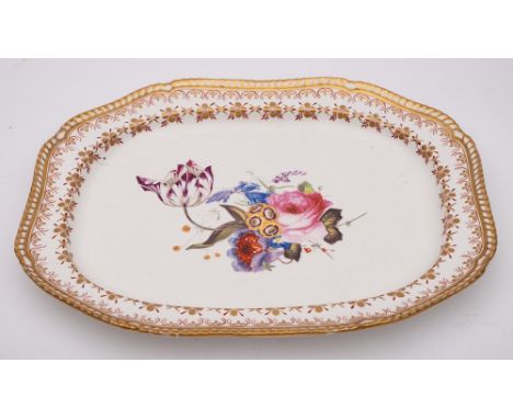 An English porcelain meat dish: of canted rectangular form and gadrooned border, the centre enamelled with garden flowers wit