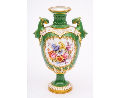 A Royal Worcester porcelain pedestal vase: of two handled form with raised neck and strap work, painted with flowers within a