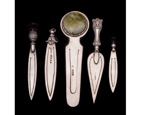 A collection of five assorted silver book marks, various makers and dates: two with thistle top terminals, one in the form of