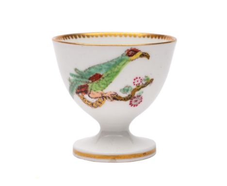 A rare Swansea egg cup: with coloured transfer decoration of two parakeets chained to knarled branches, circa 1815.*Notes    