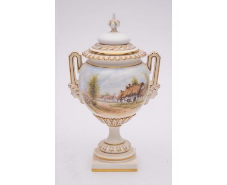 A Royal Worcester porcelain two handled vase and cover: of pedestal form the handles with female mask terminals, enamelled wi