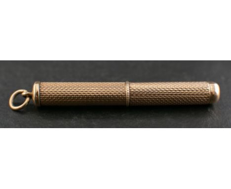A 9ct gold toothpick with engine turned decoration,: with hallmarks for Birmingham, 1973, length (inc bale) ca. 5.2cm, total 