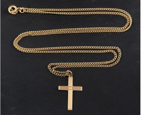 An engine turned cross pendant,: stamped '9CT', length ca. 2.7cm, with a curb-link chain, stamped '9K', length ca. 63cm, tota